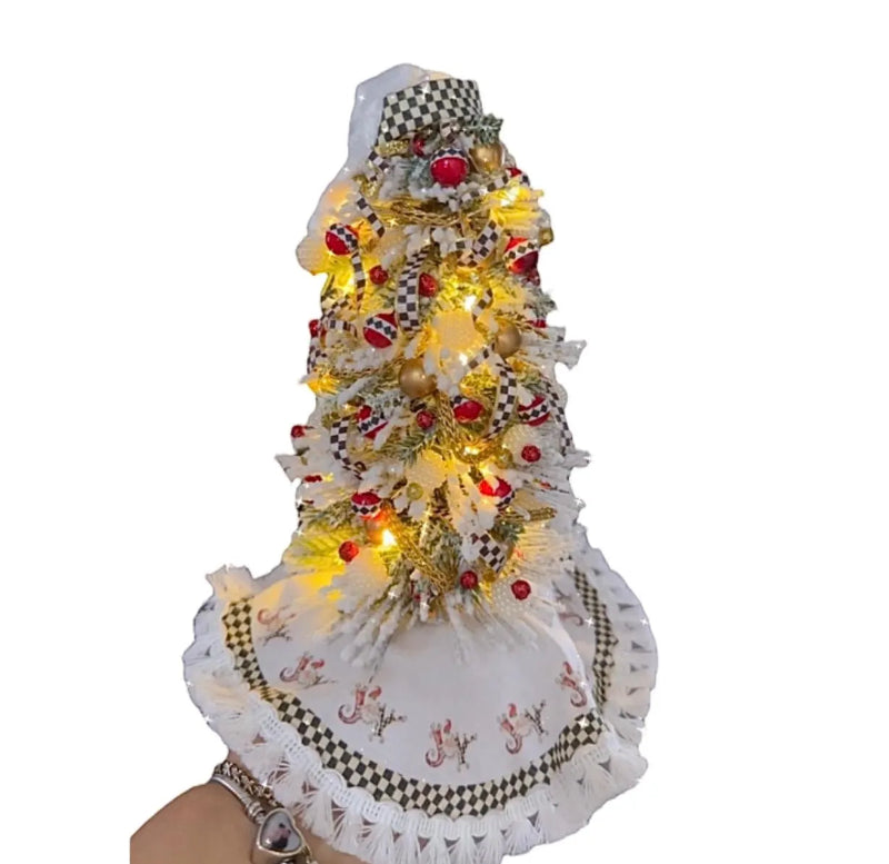 Decorative Christmas tree with lights and ornaments on a white background
